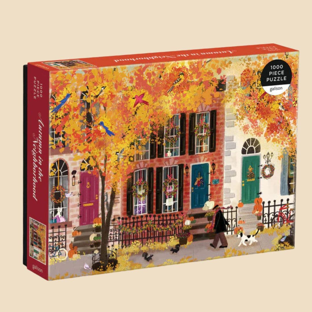 Autumn in the Neighborhood 1000-piece puzzle with colorful fall trees, decorated row houses, and cozy seasonal details.